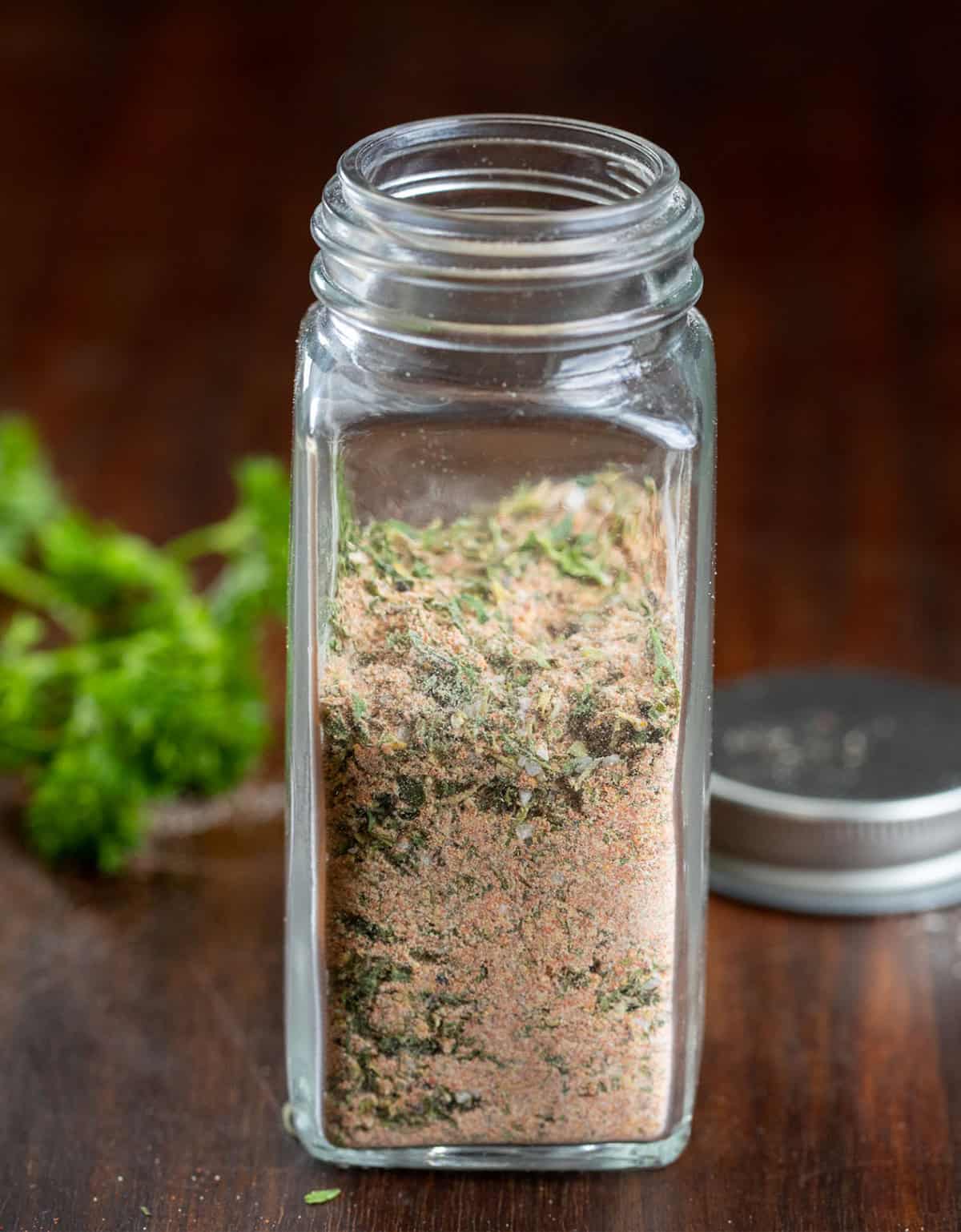 This blackened ranch seasoning is a quick homemade mix that turns into an easy dip or creamy dressing in just a few minutes. It starts with simple pantry spices and adds a little ranch-style herb flavor with a hint of spice and smoky depth. Jar of Blackened Ranch Seasoning on a wooden table.