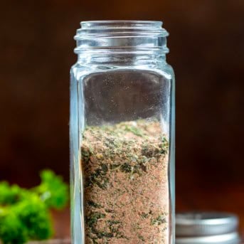 Jar of Blackened Ranch Seasoning on a wooden table.