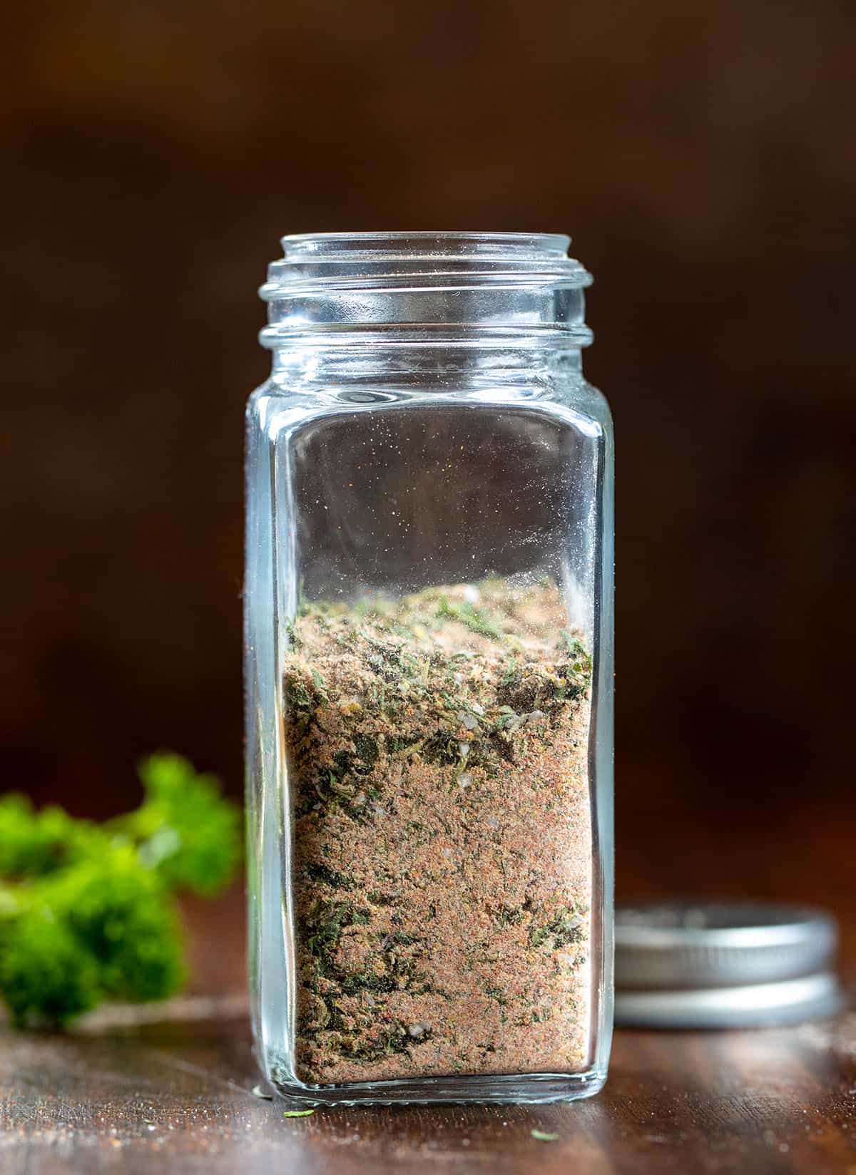 Jar of Blackened Ranch Seasoning on a wooden table.