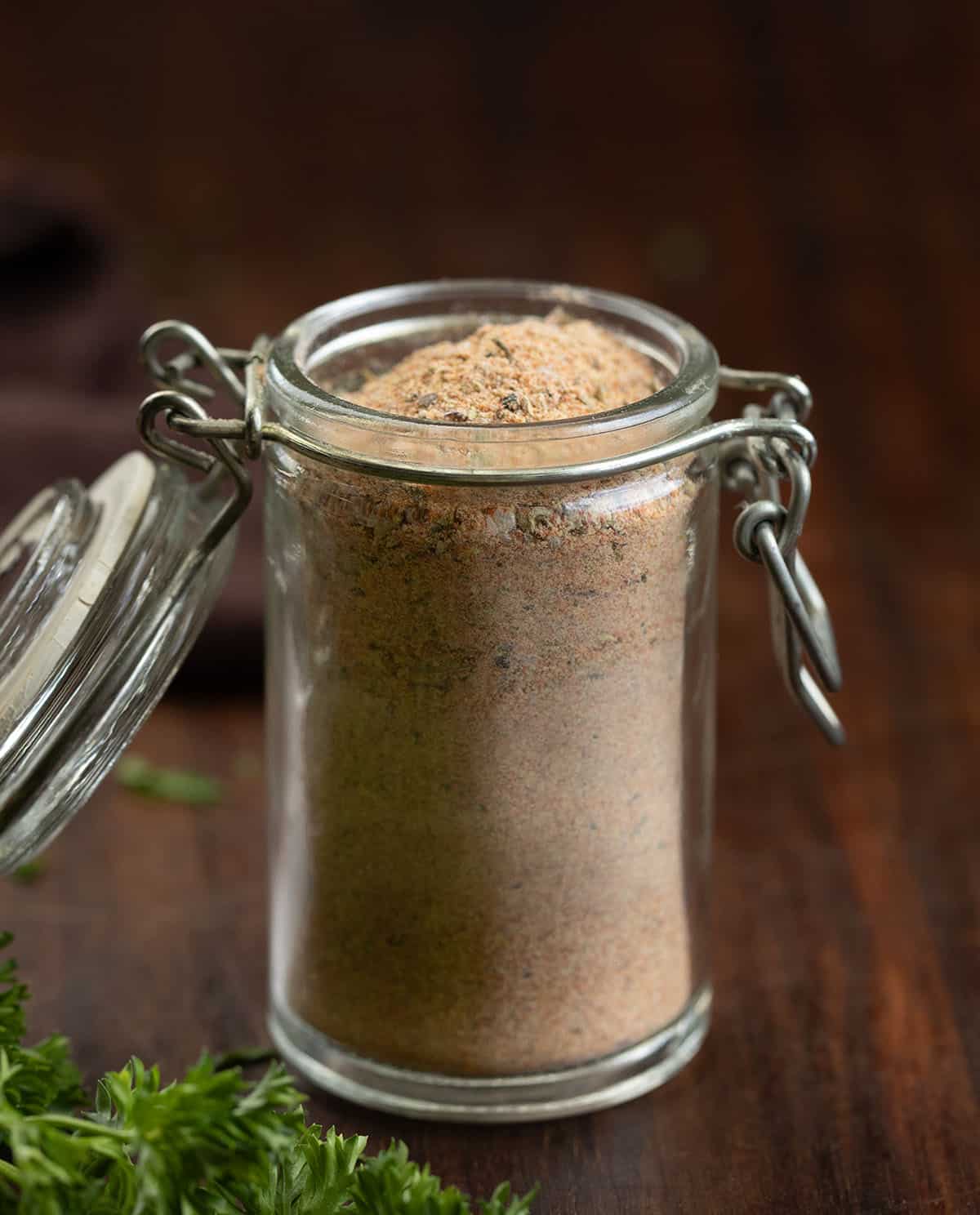 This homemade Cajun seasoning is the kind of simple pantry staple that makes everyday cooking a little more exciting. It comes together in just a few minutes and gives you that classic Cajun flavor you can sprinkle on just about anything. Jar of Cajun Seasoning on a wooden table.