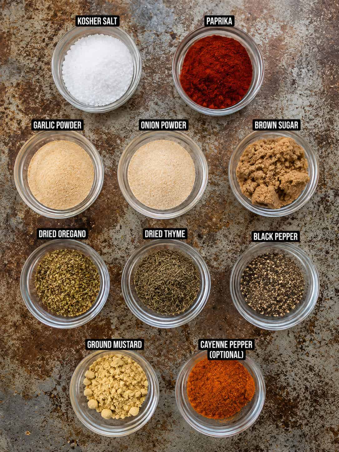 This chicken seasoning is one of those blends I reach for constantly, especially when I want big flavor without overthinking dinner. It’s smoky, savory, slightly sweet, and works on just about any cut of chicken, whether you’re grilling, baking, pan-searing, or air frying. Raw ingredients in glass jars for making Chicken Seasoning.