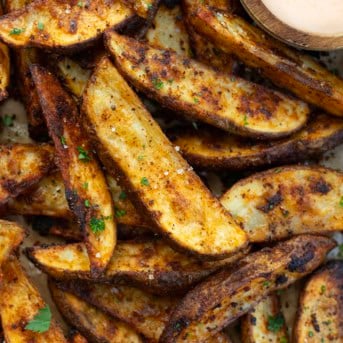 Close up of Crispy Potato Wedges on a sheet pan.