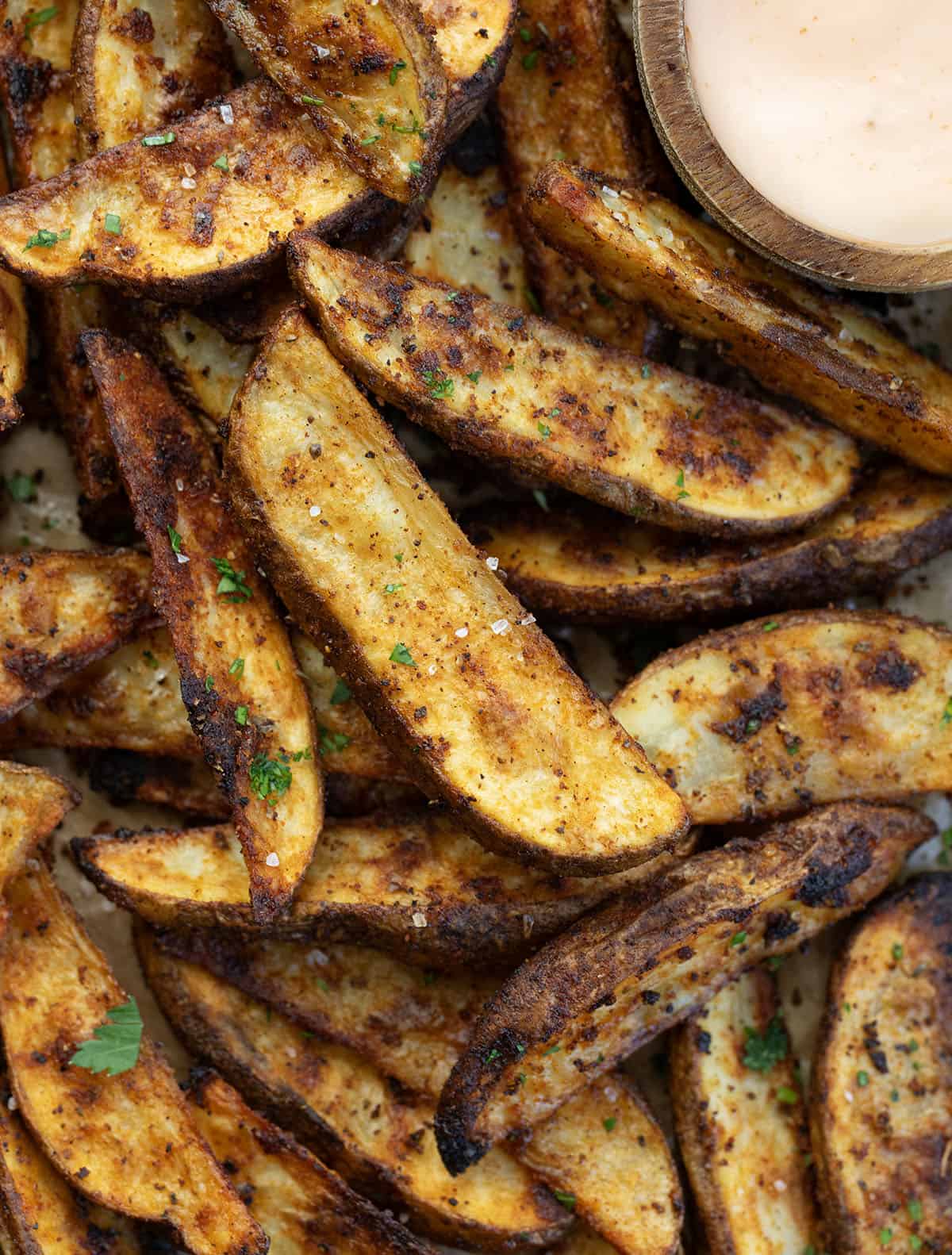 Close up of Crispy Potato Wedges on a sheet pan.