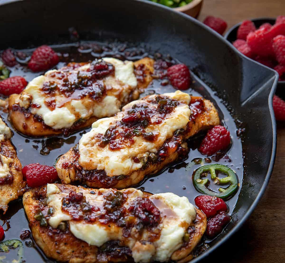 Close up of Raspberry Jalapeño Cream Cheese Chicken in a skillet.