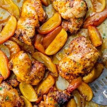 CLose up of Sheet Pan Apple Chicken with a spatula.
