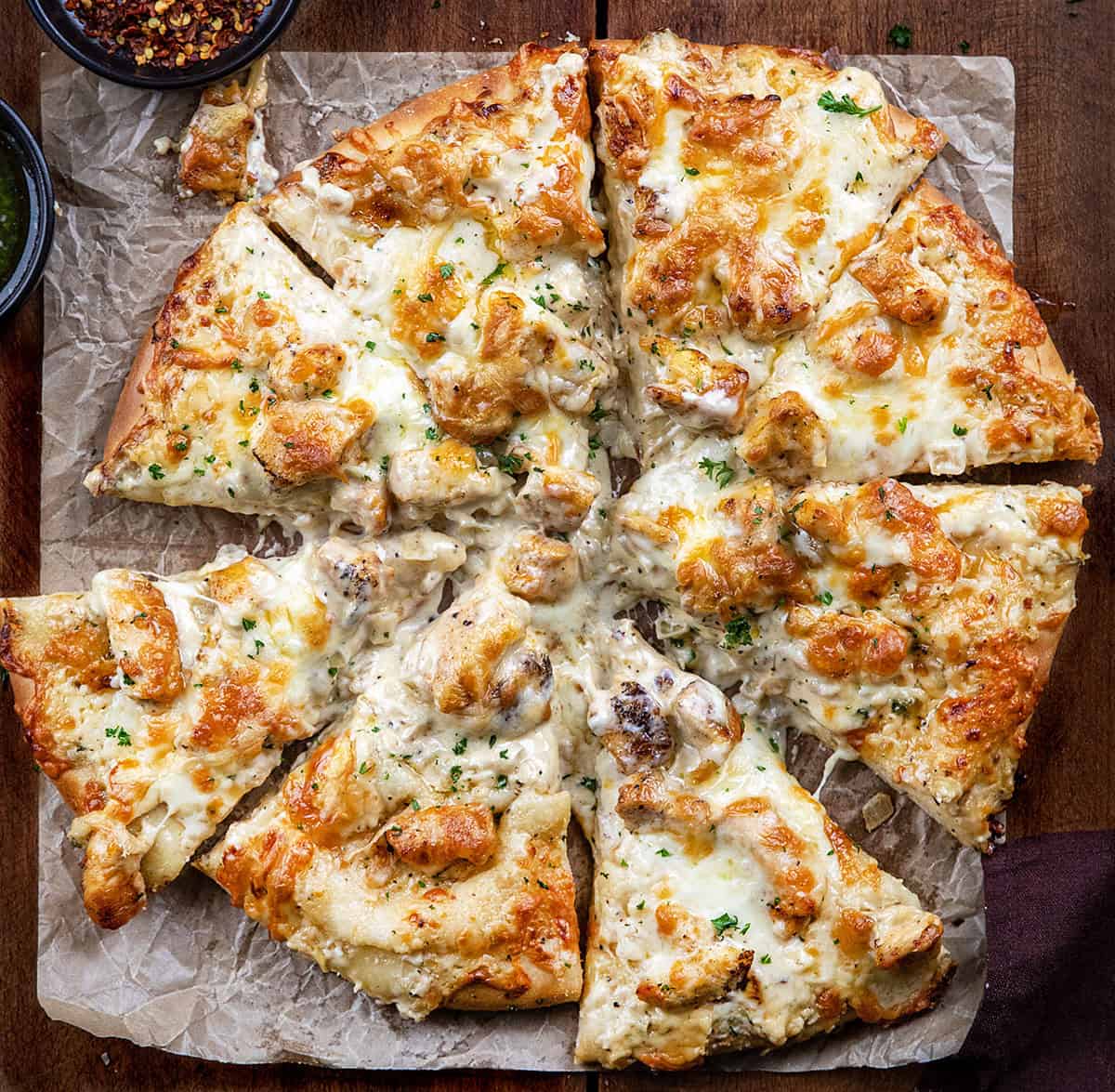 I loved my Chicken Alfredo Garlic Bread so much, I had to make this Chicken Alfredo Pizza, too! It takes everything you love about creamy Alfredo sauce, tender chicken, and melty cheese, and piles it all onto a soft homemade pizza dough that bakes up golden and irresistible!