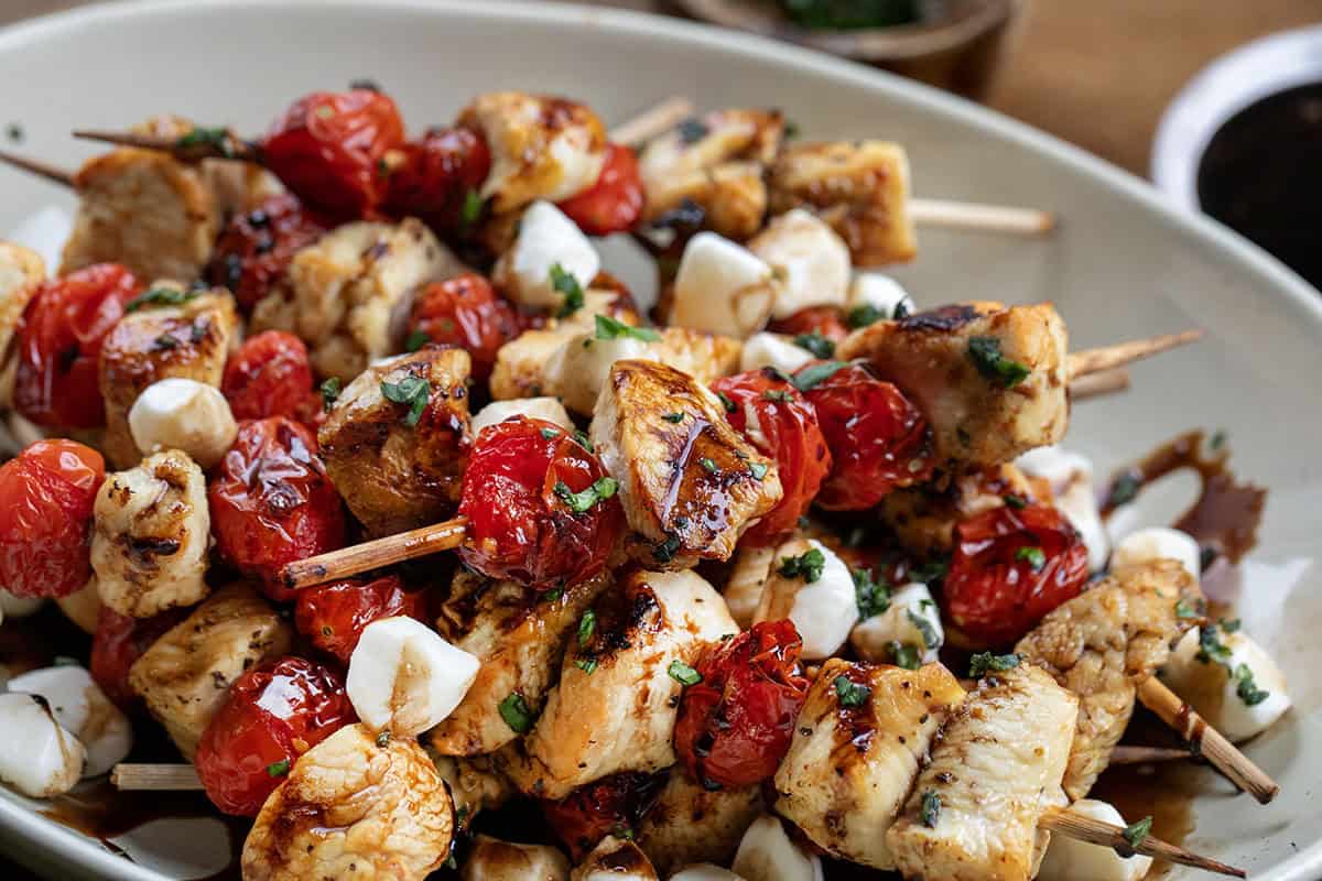 Chicken Caprese Skewers on the platter close up Chicken Caprese Skewers on the platter close up.