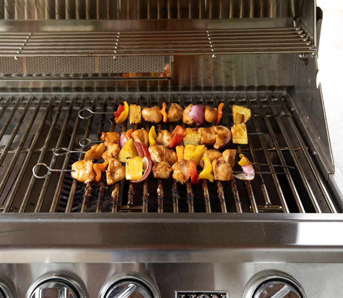 Hawaiian Chicken Skewers on a grill Hawaiian Chicken Skewers on a grill.