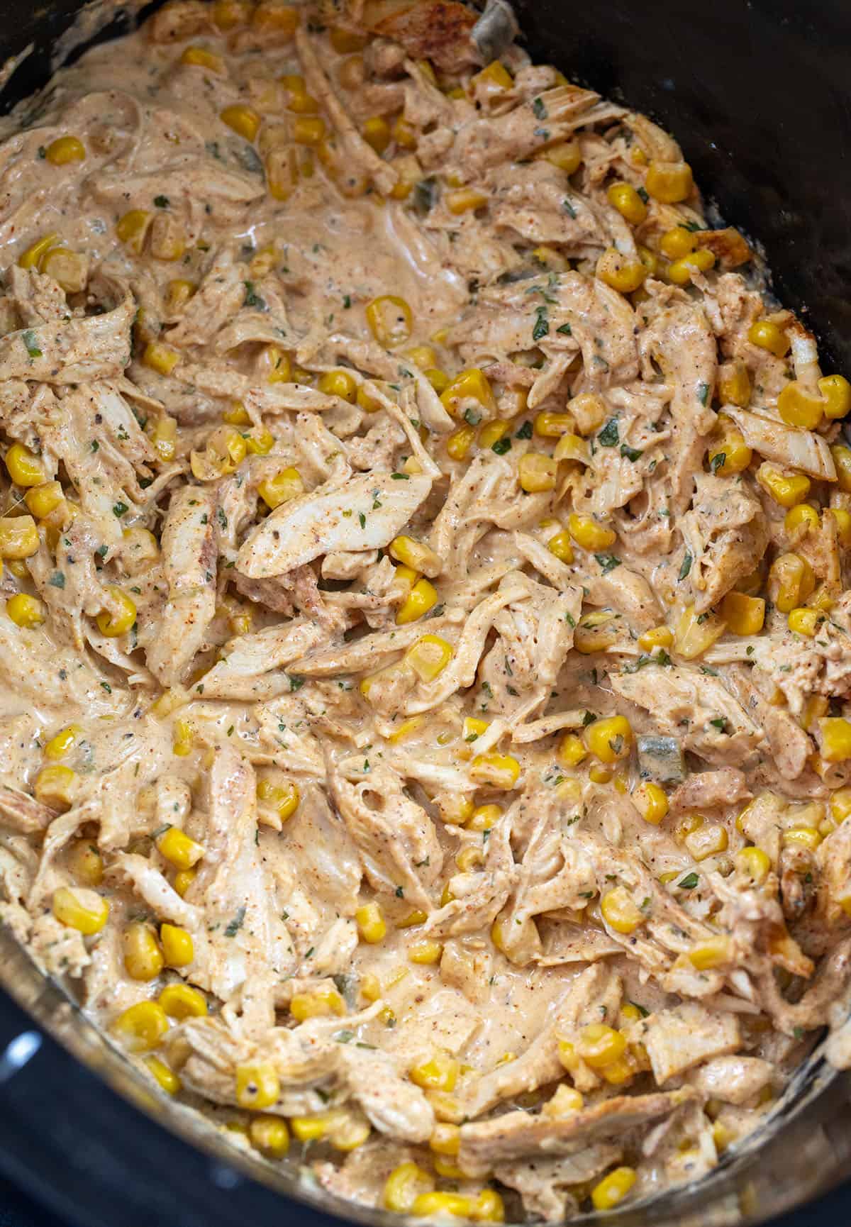 Close up of Slow Cooker Street Corn Chicken in a crockpot Close up of Slow Cooker Street Corn Chicken in a crockpot.
