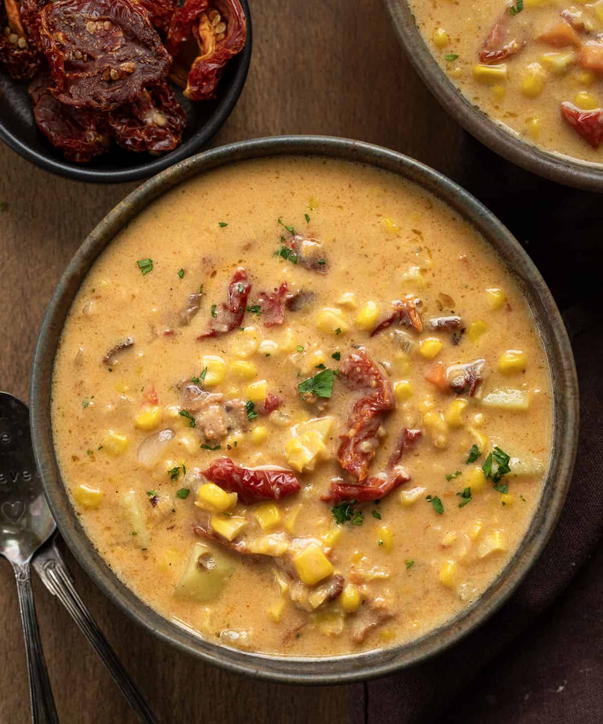 This Sun-Dried Tomato Corn Chowder is a rich, creamy soup made with sweet corn, tender vegetables, smoky bacon, and sun-dried tomatoes for extra depth of flavor!