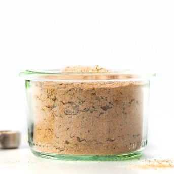 Jar of Vegetable Seasoning on a white table.