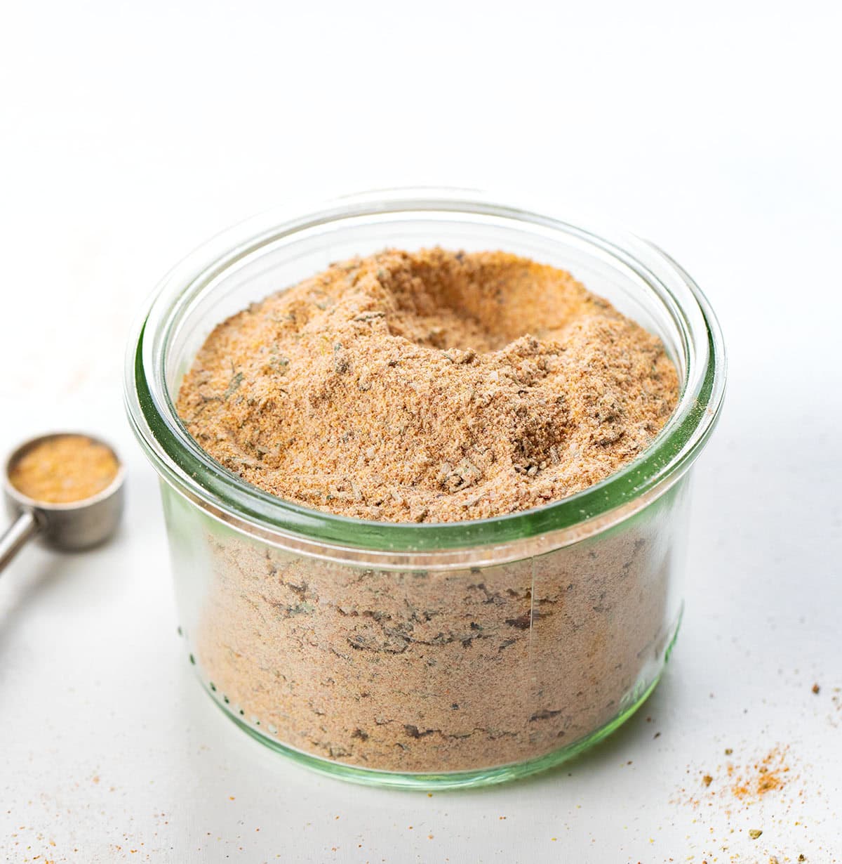 Make your own Vegetable Seasoning blend in 5 minutes! This savory homemade mix with garlic, onion, paprika & herbs elevates roasted broccoli, potatoes, carrots & more. Better than store-bought! Glass jar filled with Vegetable Seasoning.