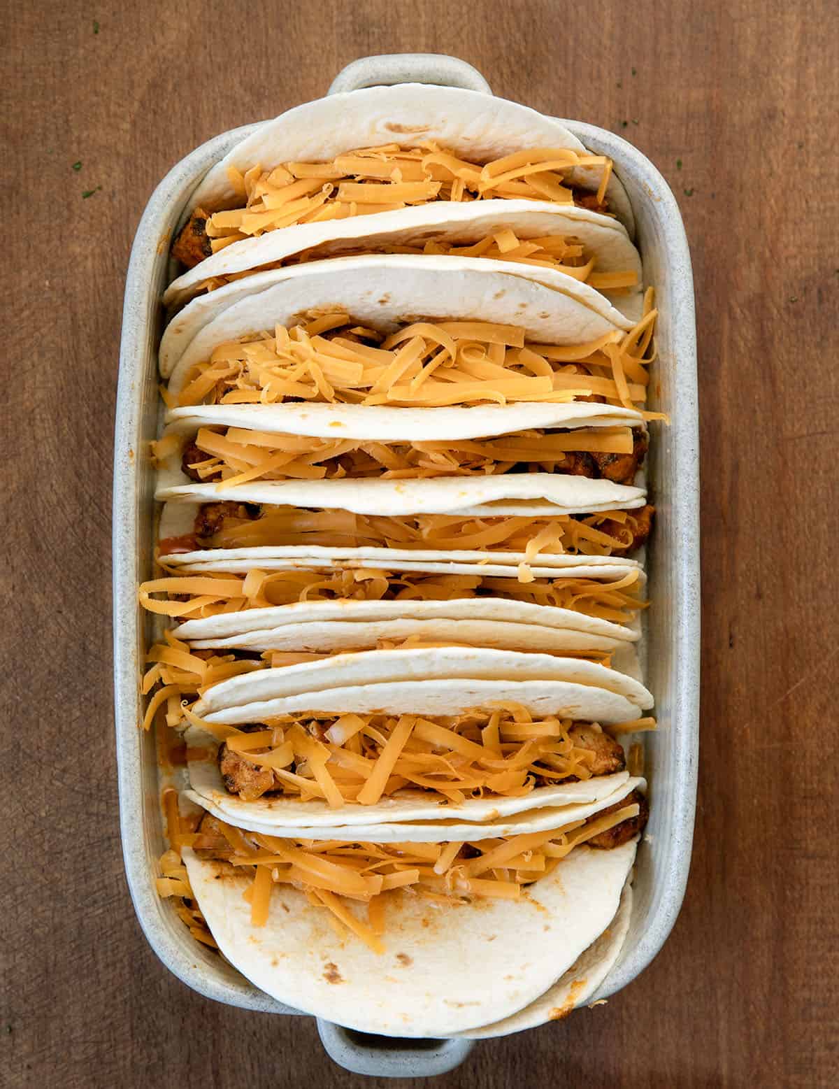 Baked Buffalo Chicken Tacos before baking in the oven Baked Buffalo Chicken Tacos before baking in the oven.