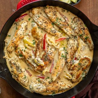 Creamy Pepperoncini Chicken Skillet on a wooden table from overhead.