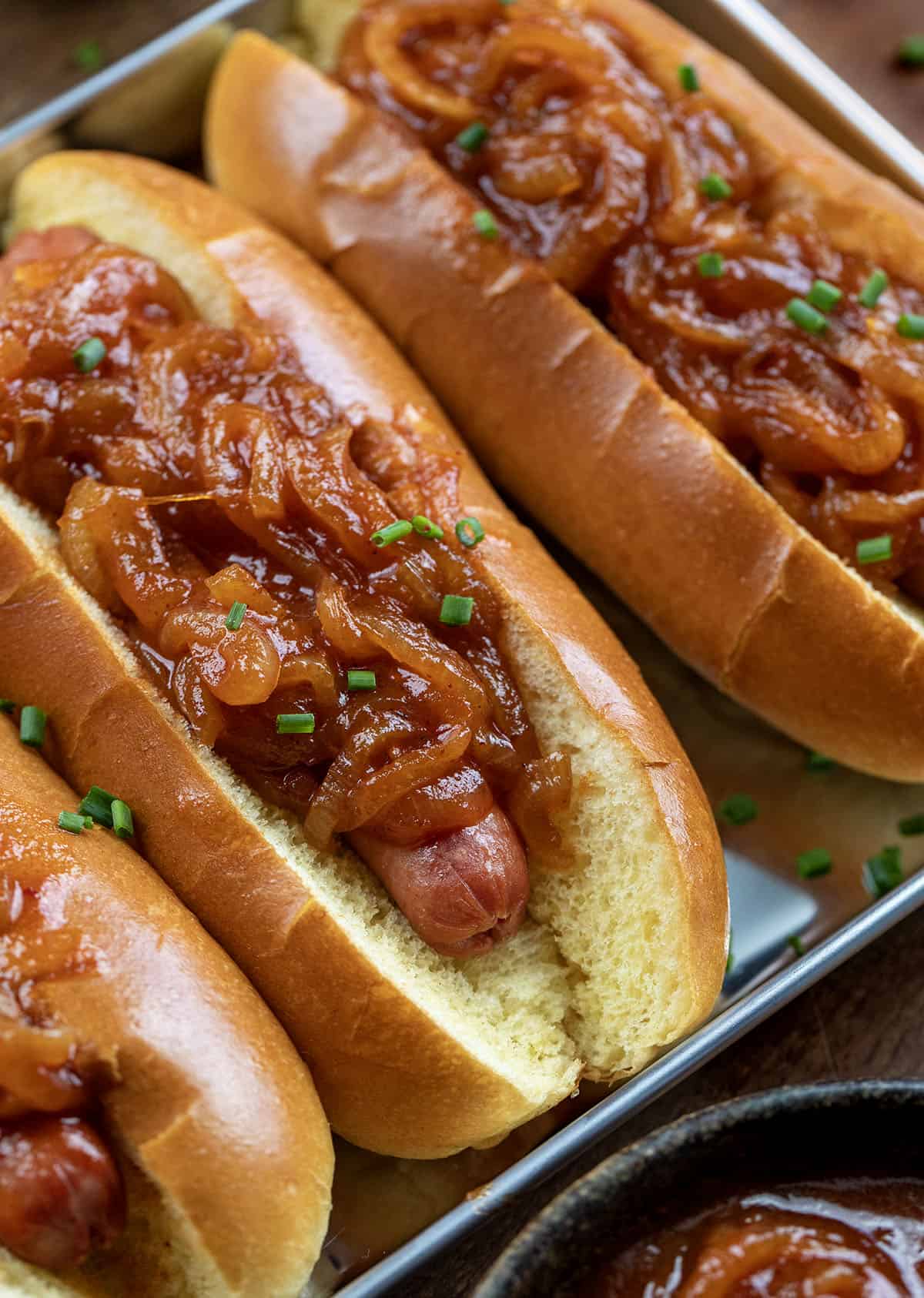 Close up of hot dogs covered in Hot Dog Onion Sauce Close up of hot dogs covered in Hot Dog Onion Sauce.