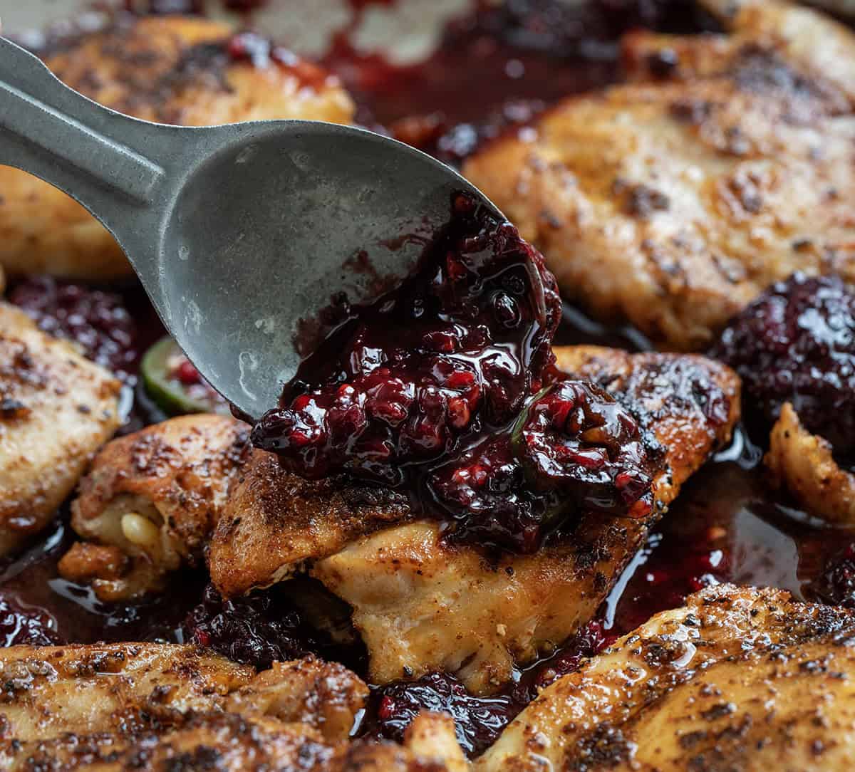 Spooning sauce over Blackberry Fire Chicken Spooning sauce over Blackberry Fire Chicken.