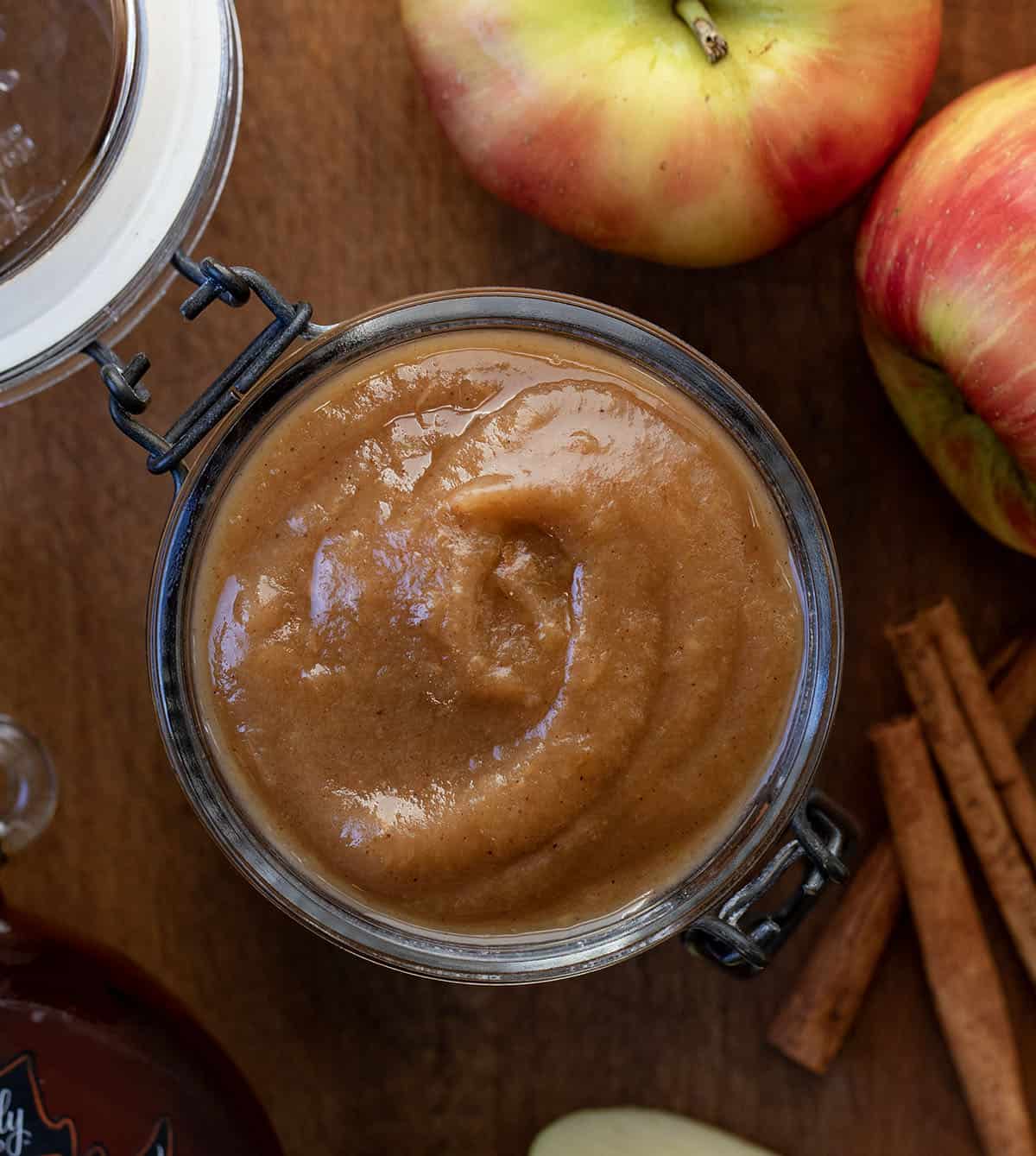 Looking down on a jar of Maple Apple Butter on a wooden table Looking down on a jar of Maple Apple Butter on a wooden table.