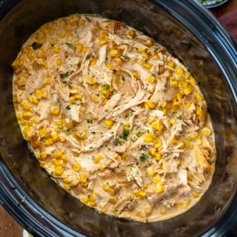 Slow Cooker Street Corn Chicken on a wooden table from overhead.