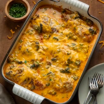 Broccoli Cheddar Chicken Casserole on a wooden table.