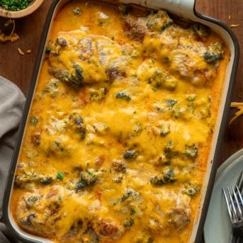 Broccoli Cheddar Chicken Casserole on a wooden table from overhead.