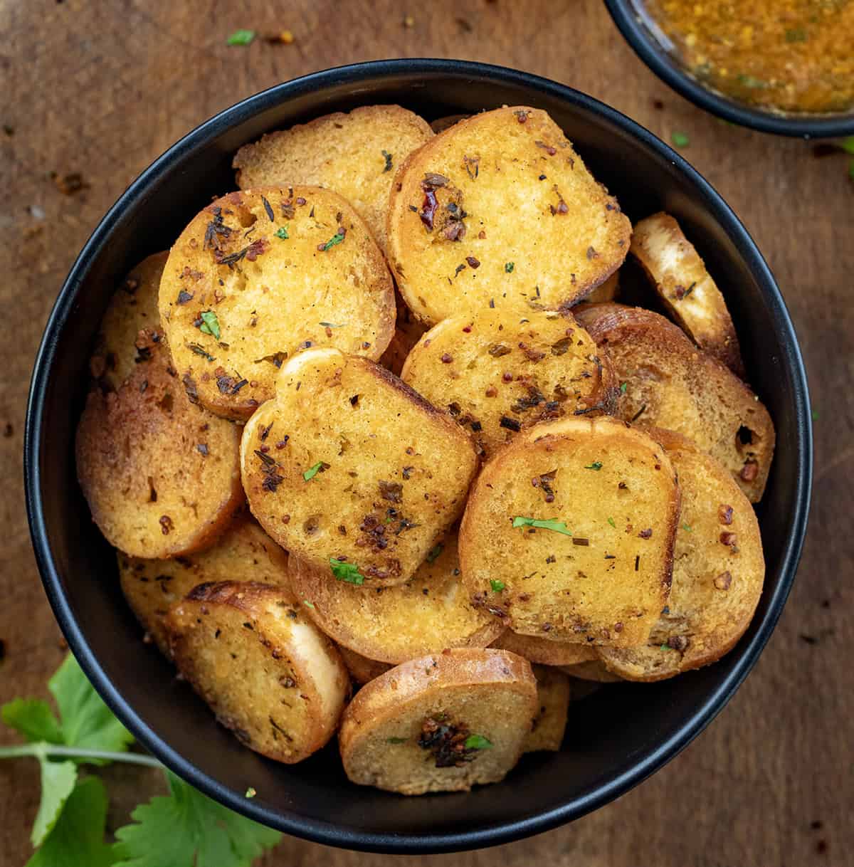 Bowl of Cowboy Butter Bagel Chips next to a bowl of cowboy butter.