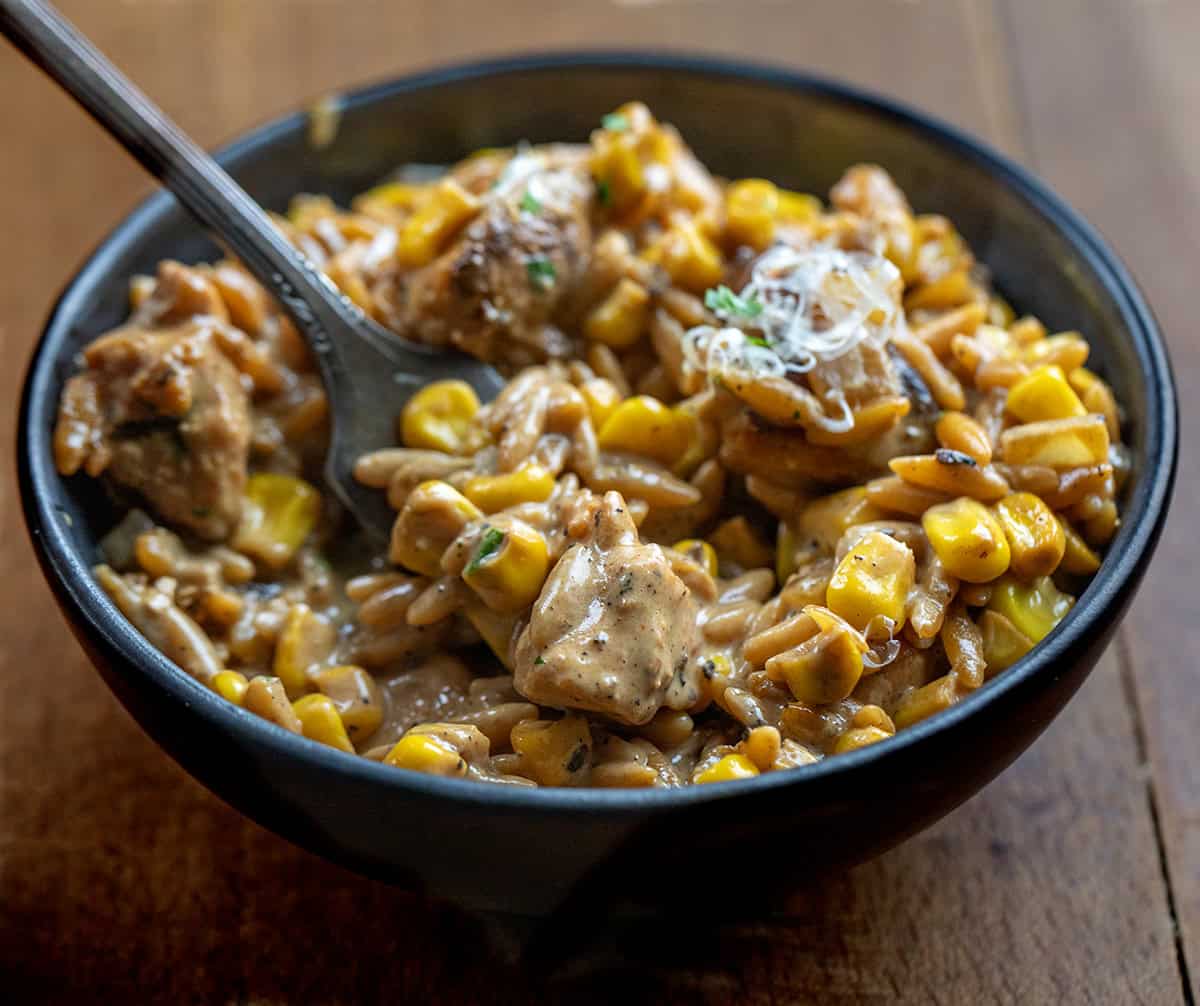 Close up of a bowl of Creamed Corn Orzo with Chicken Close up of a bowl of Creamed Corn Orzo with Chicken.