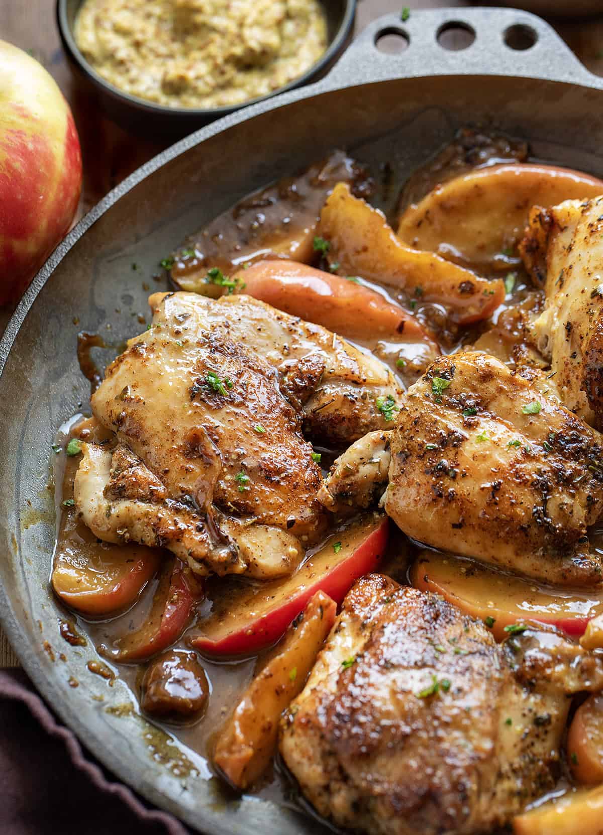 Dijon Apple Shallot Chicken in the pan close up Dijon Apple Shallot Chicken in the pan close up.