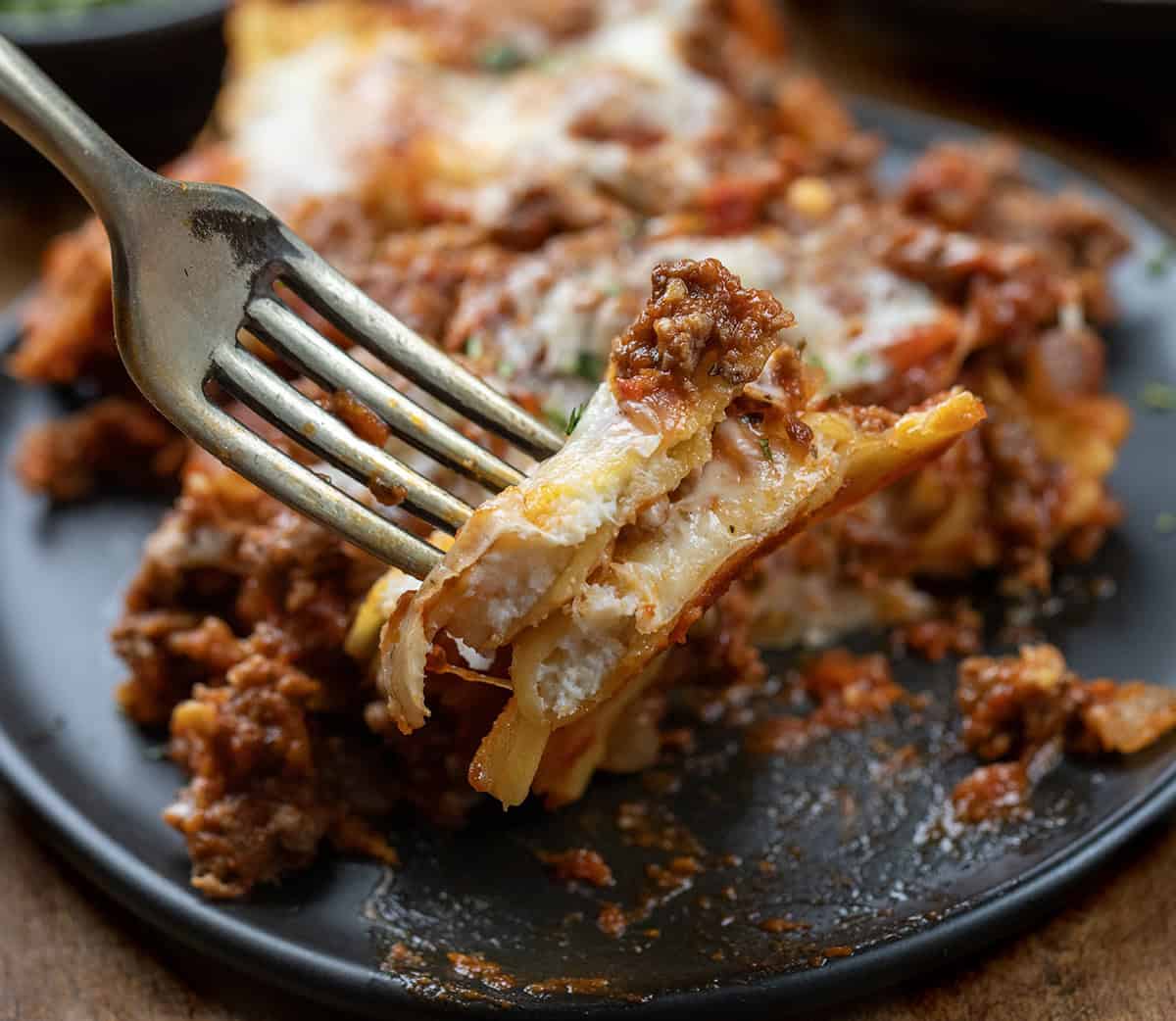Forkful of halved ravioli held above Easy Baked Ravioli Forkful of halved ravioli held above Easy Baked Ravioli.
