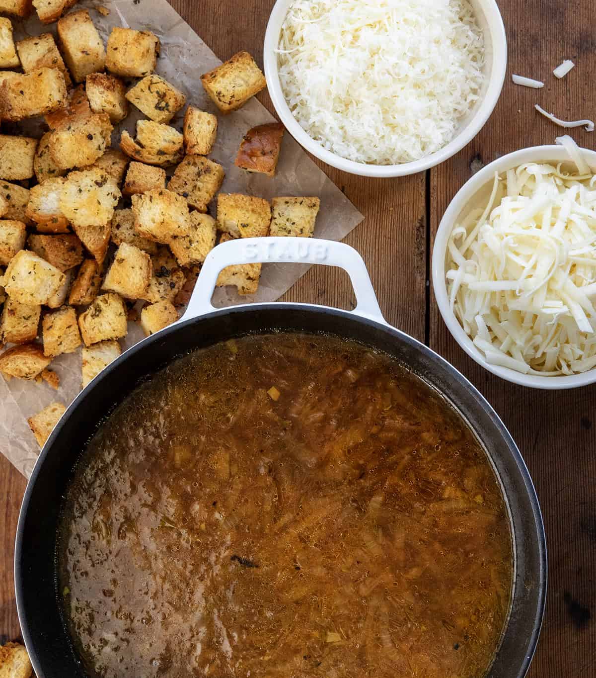 Pot of French Onion Soup with gruyere and parmesan cheese and homemade croutons Pot of French Onion Soup with gruyere and parmesan cheese and homemade croutons.
