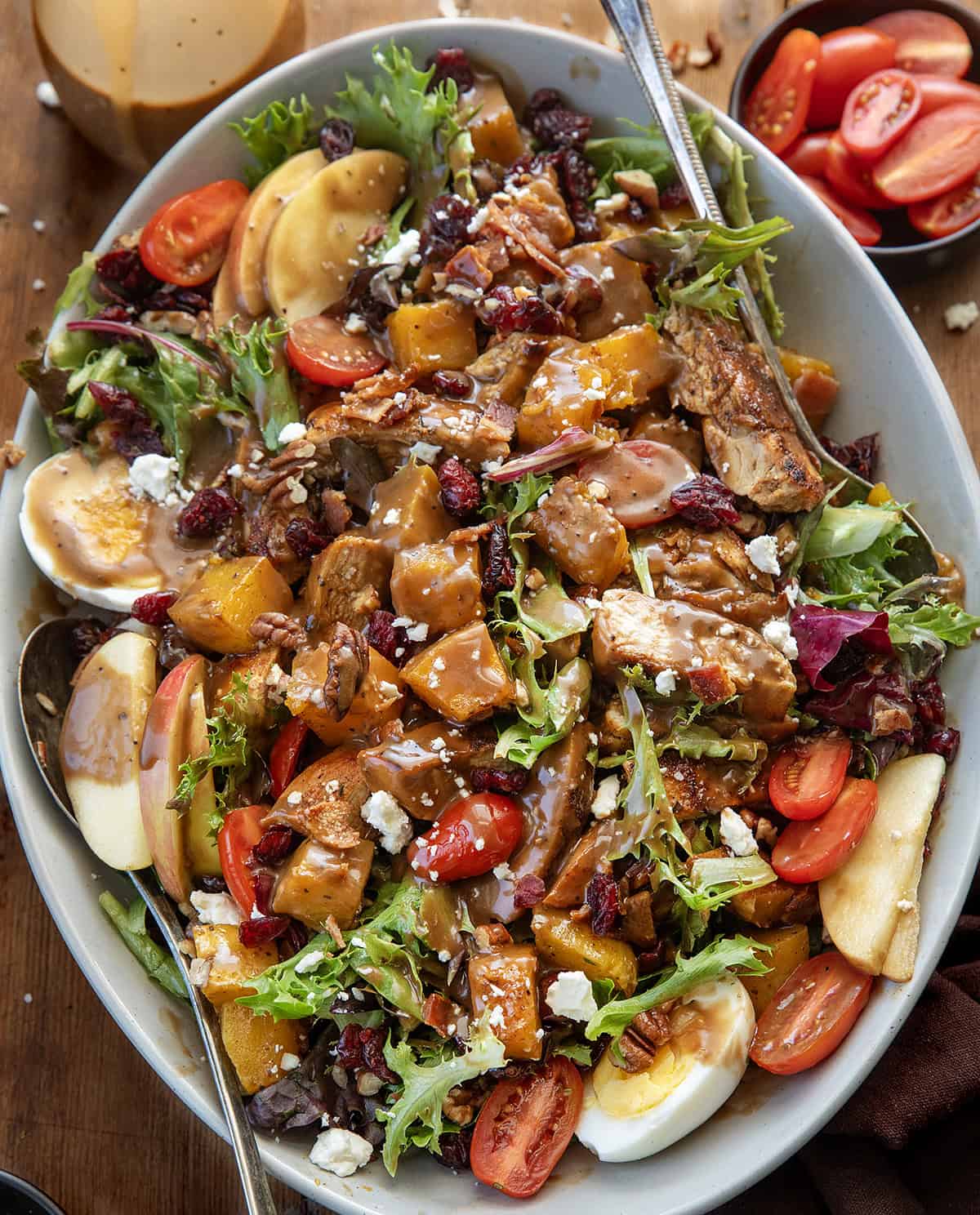 Harvest Chicken Salad in a serving platter on a wooden table from overhead.