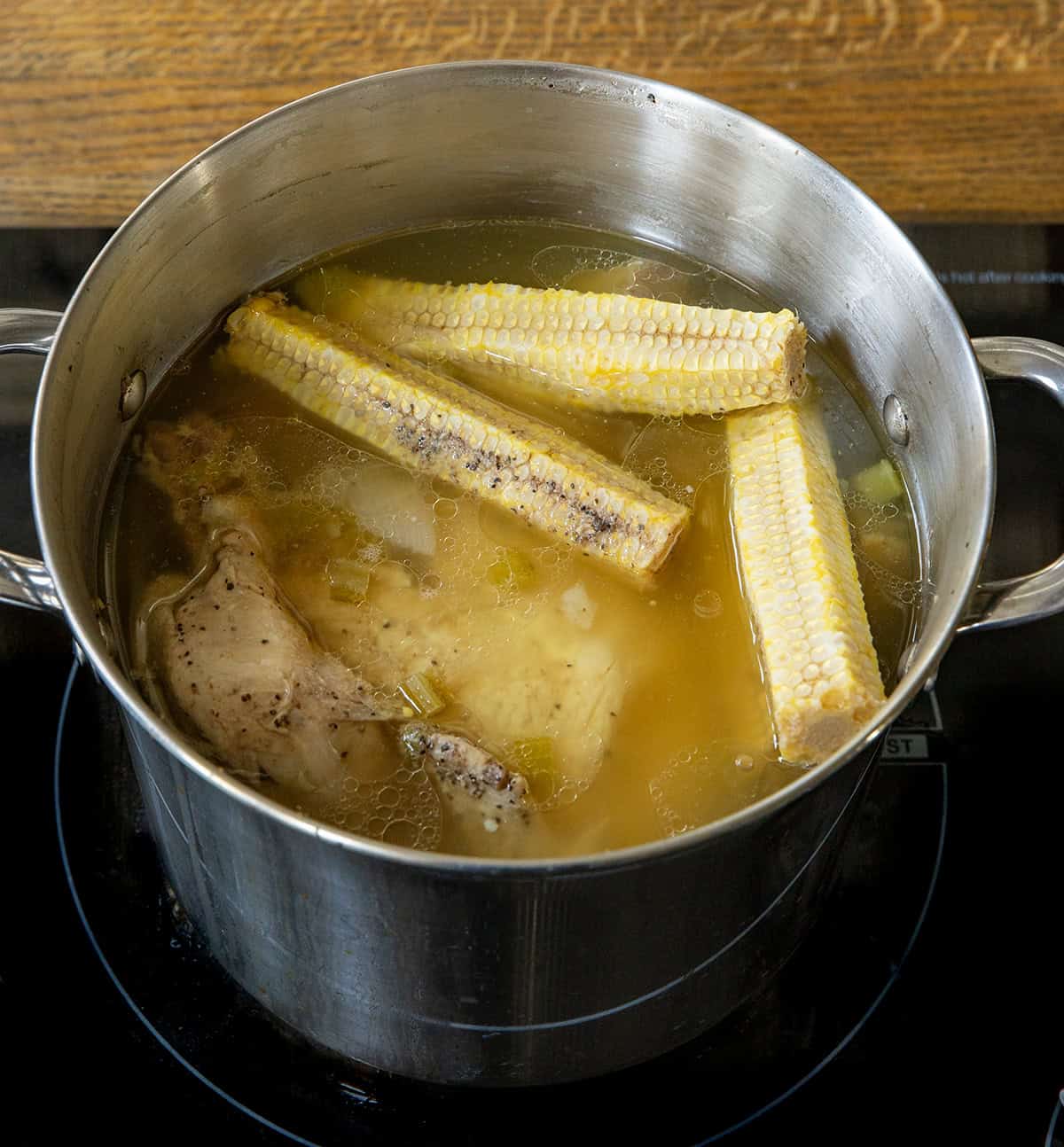 Ingredients for Pennsylvania Dutch Chicken Corn Soup in a pot while cooking Ingredients for Pennsylvania Dutch Chicken Corn Soup in a pot while cooking.