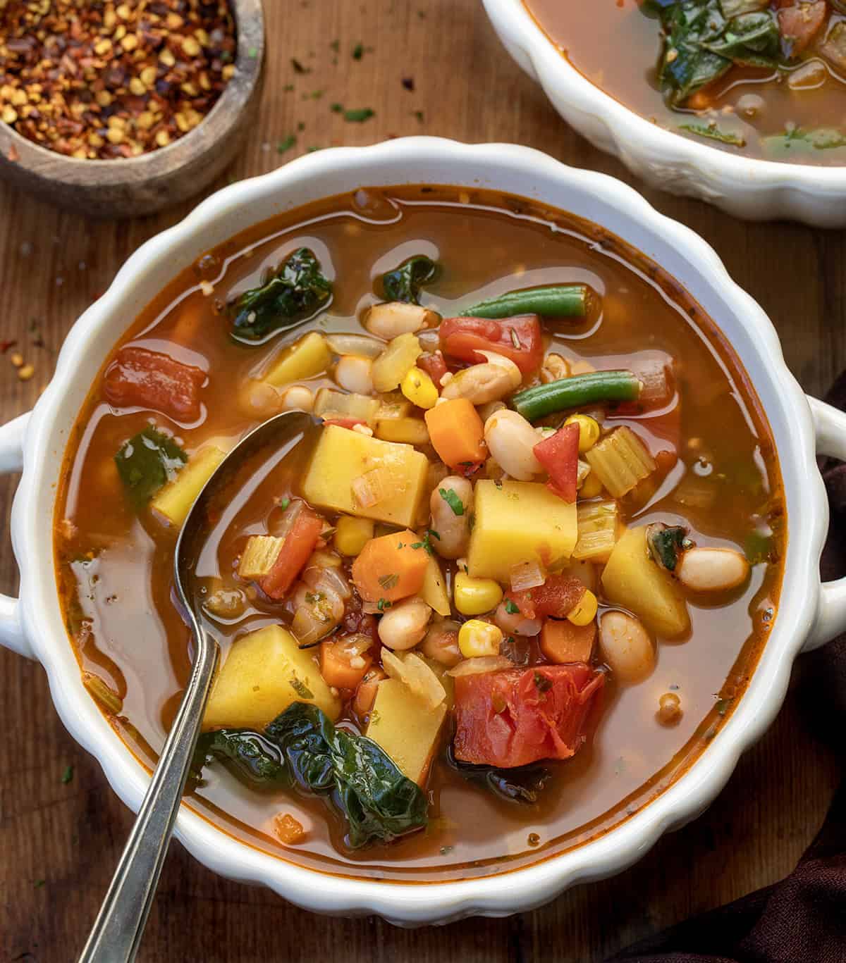 Bowls of Vegetable Soup on a wooden table Bowls of Vegetable Soup on a wooden table.
