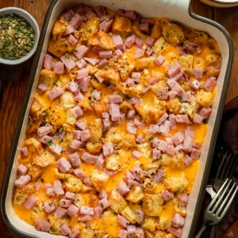 Cowboy Butter Ham and Cheese Croissant Bake on a wooden table from overhead.