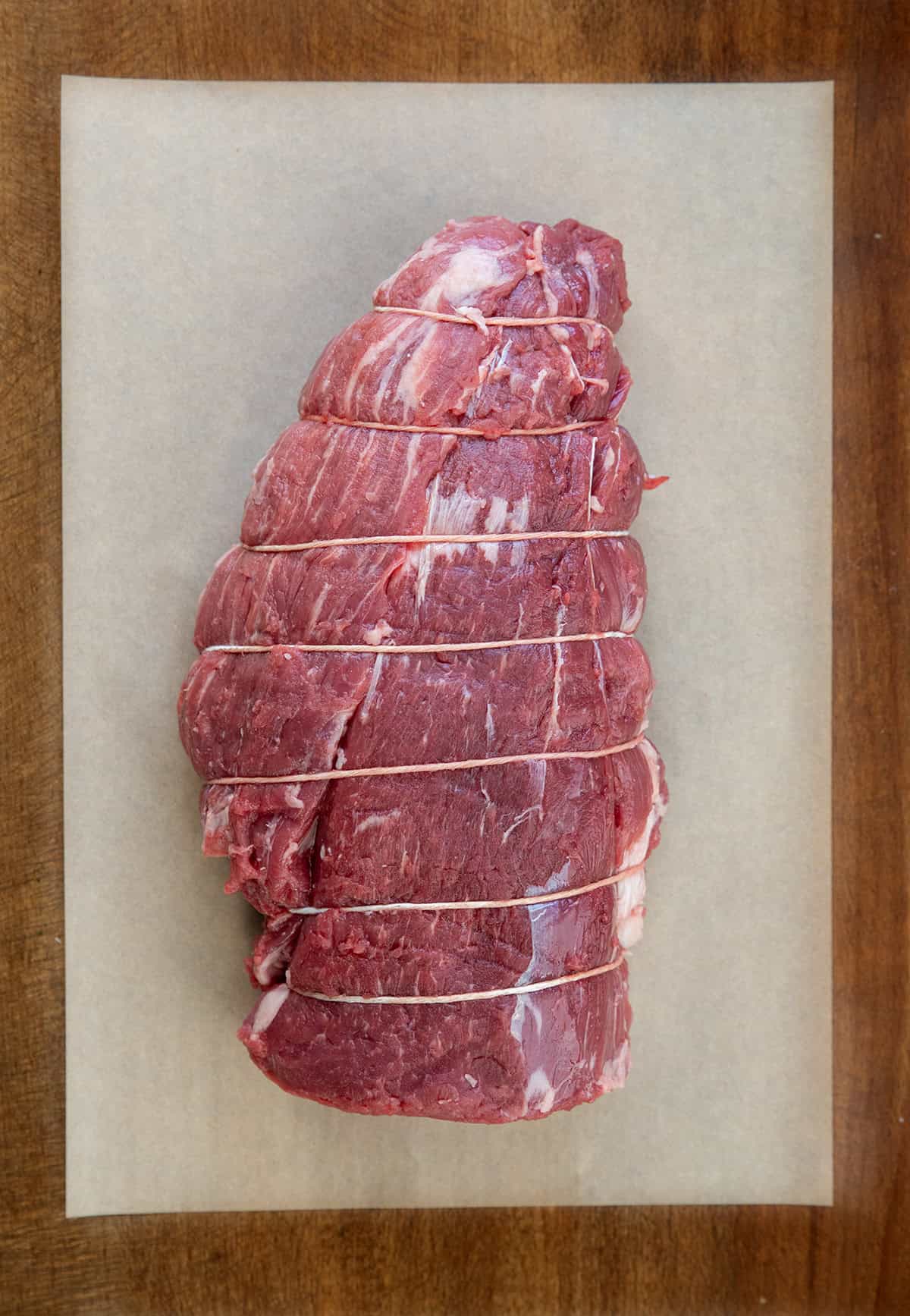 Tied up raw beef tenderloin Tied up raw beef tenderloin.