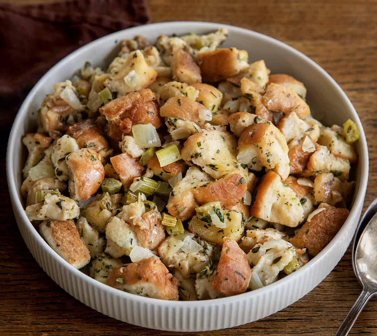 Bowl of Slow Cooker Stuffing on a wooden table Bowl of Slow Cooker Stuffing on a wooden table.