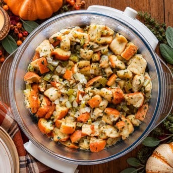 Slow Cooker Stuffing on a thanksgiving table.